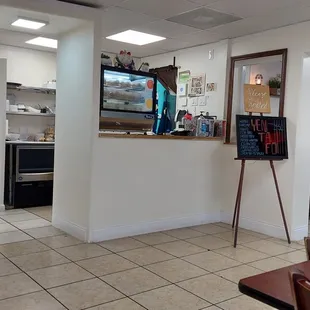 a flat screen tv in the kitchen