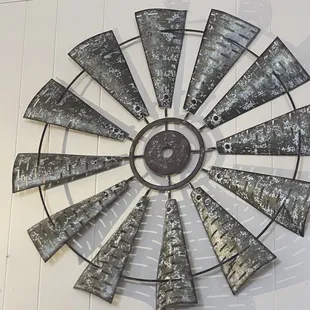 a windmill clock on the wall