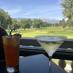 a drink and a view of a golf course