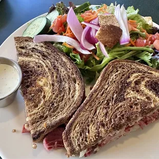 Reuben sandwich with a side salad