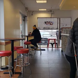 a woman walking through a restaurant