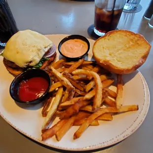 The V-8 Special hamburger with swiss cheese, thousand island dressing, onions, lettuce, and tomato.