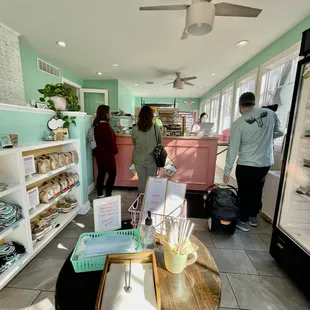 people in a bakery waiting for their order