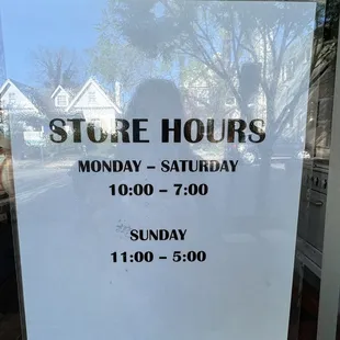 a store hours sign