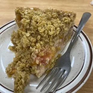 a piece of pie on a plate with a fork