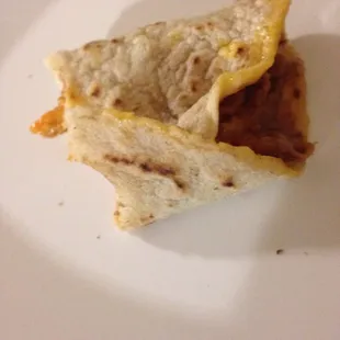 Half eaten bean &amp; cheese taco. Yum!