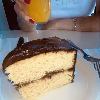 Slice of Yellow with Chocolate Frosting Cake