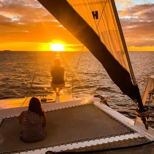 Sitting in the nets at sunset on Pau Hana.