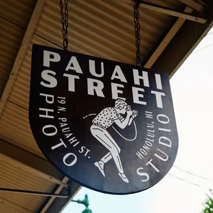 The Pauahi Street Photo Studio sign marks the entrance to a creative, welcoming space in Honolulu's Chinatown