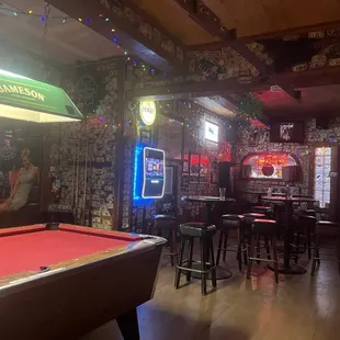 Jukebox on the wall and second pool table