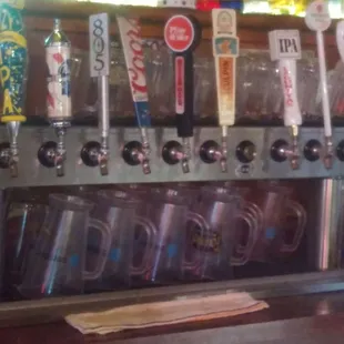 a row of beer taps