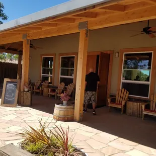 a man standing outside a winery