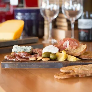 Butcher's Board featuring a selection of salumes and artisan cheeses