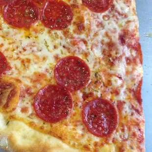 Thin crust pepperoni slice
