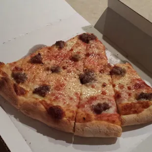 Slice of sausage pizza