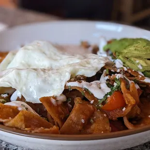 Chilaquiles Rancheros with add on: Carnitas (hidden under eggs).