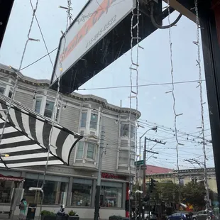 Paula&apos;s cafe sign with phone number. Photo from counter seat at front window.