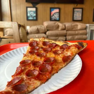 a slice of pepperoni pizza