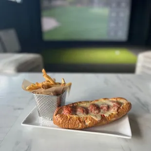 Paulie's meatball sub is getting strong reviews.  Notice the simulator in the background!  It has over 14 sports for you to enjoy!