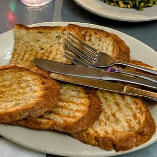 Buttered, toasted bread. Generous and yummy.