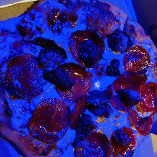 a pepperoni pizza in a box
