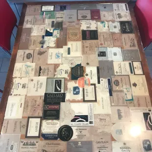 Table adorned with old wine bottle labels