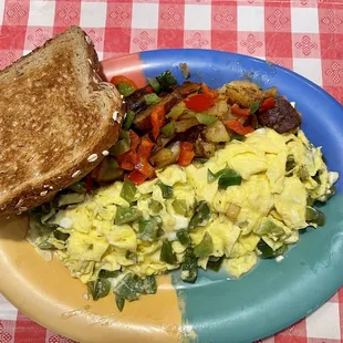 Egg scramble with feta and green peppers. Wheat toast dry. Pauline&apos;s potatoes