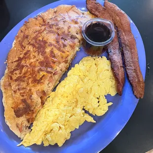 Bacon &amp; Cheddar Pancake (cut in half and stacked) eggs, bacon