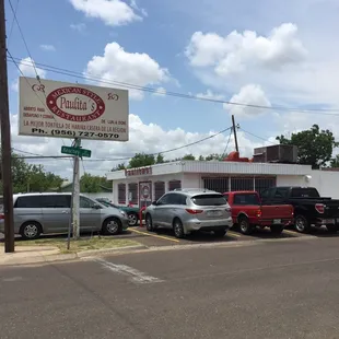 cars parked in front of the restaurant