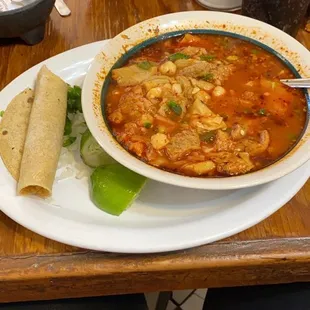 a plate of soup and a burrito