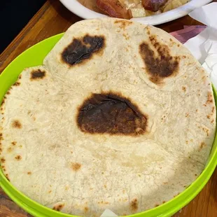 a plate of food with a face on it