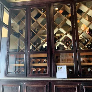 a wine rack with wine bottles