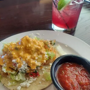 Hibiscus happy hour cocktail and fish taco happy hour appetizer.