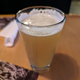 a glass of beer on a table