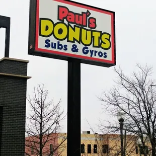 a sign in front of a building