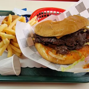 Double cheeseburger w/bacon, lettuce, tomato, pickles grilled onions with a large fry