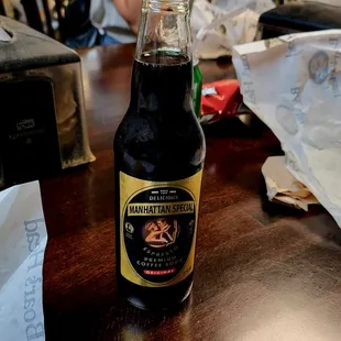 a bottle of beer and a sandwich