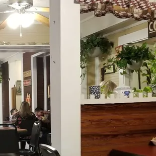 people sitting at tables in a restaurant