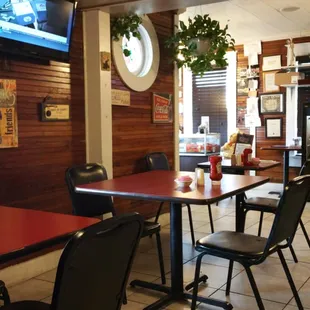 a dining area with tables and chairs