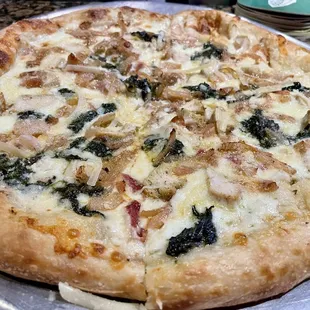 Chicken bacon spinach and onion Alfredo pizza