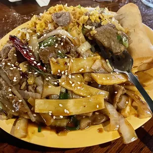 Lunch Mongolian beef with fried rice and spring roll. Also comes with a cup of soup.