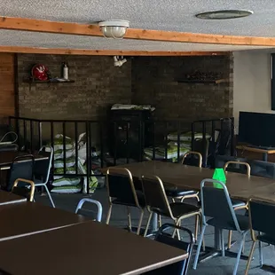 a classroom with tables and chairs