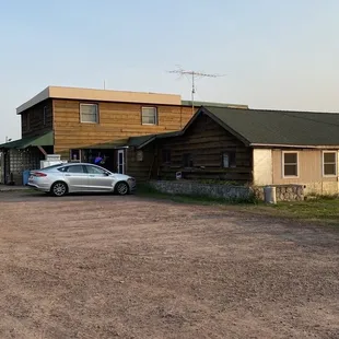 a car parked in front of it