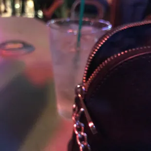 a drink and a purse