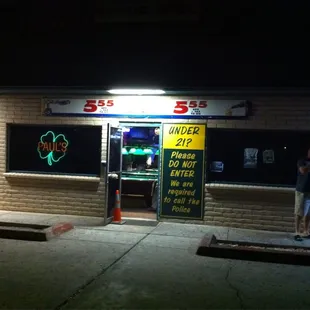 a woman standing in front of the door