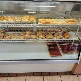 a display case filled with donuts