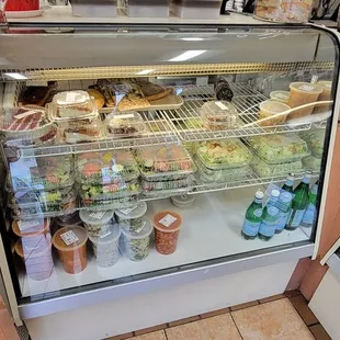 a deli case filled with food