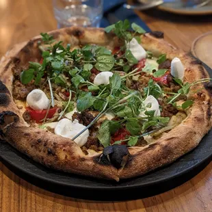 Spicy lamb sausage pizza