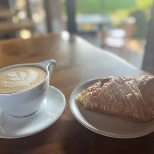 a croissant and a cup of coffee