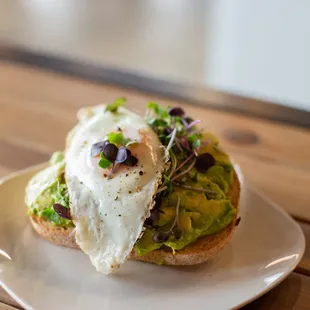 a sandwich with an egg and avocado